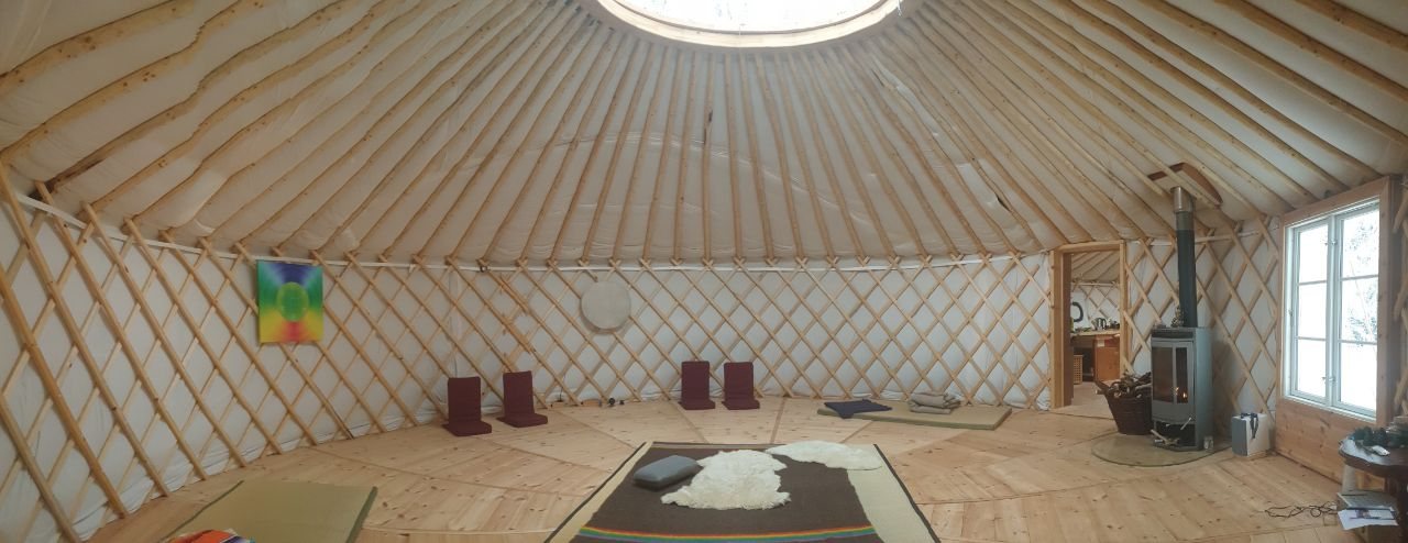 Warm, round interior of the yurt